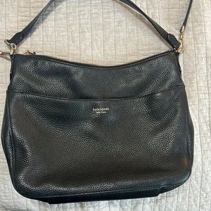 Black Kate Spade pink interior hobo bag.